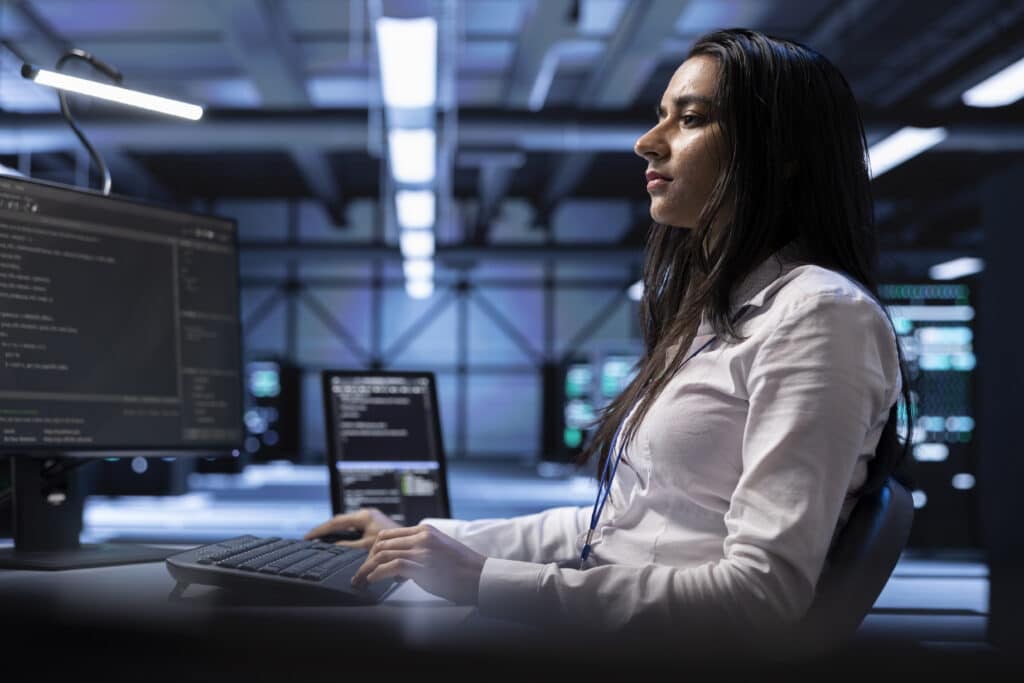 Businesswoman typing on a laptop, representing expert Azure consulting services